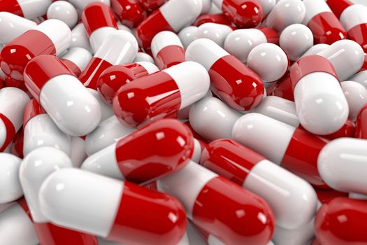 Red and white pill capsules pile
