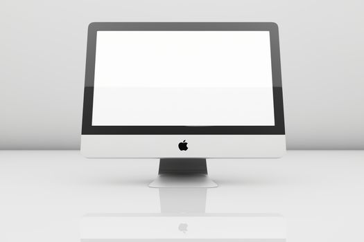 Imac on white reflective surface with blank screen