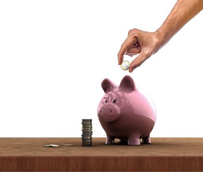 Hand inserting a coin into a piggy bank