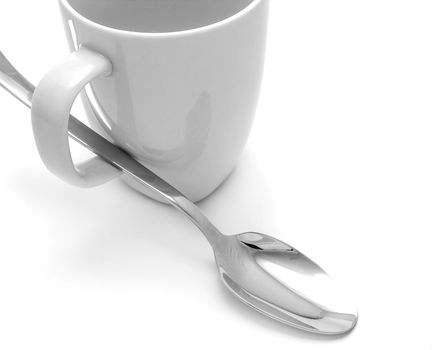 White mug and spoon on white background