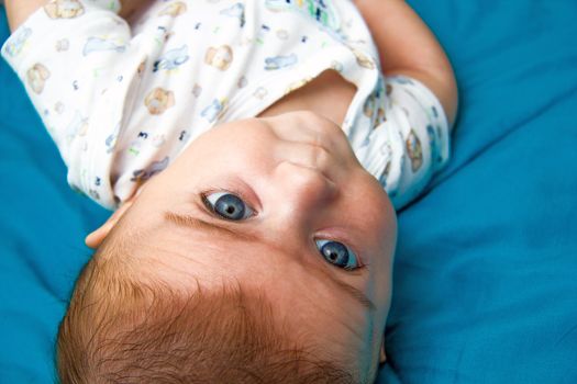 Cute blue eyed baby staring at the camera