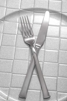 Silver Fork and knife on a dish