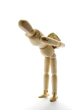 Wooden manikin carrying coins on white background