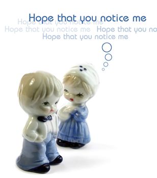 Two ceramic dolls on white. Love concept