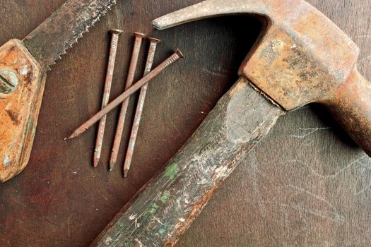 Old hammer nails and a small hand saw