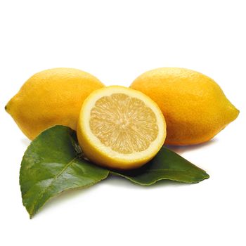 Two lemons and a half lemon on white