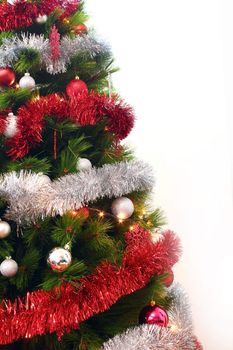 Christmas tree with decorative elements on white background