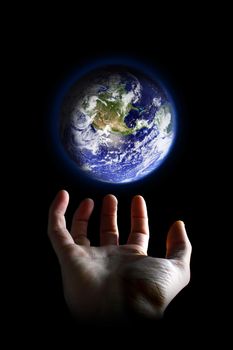Earth hovering above an hand