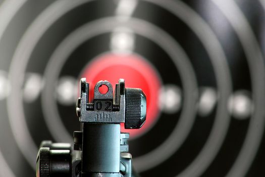 Aim sight of a gun pointing to the center of the target