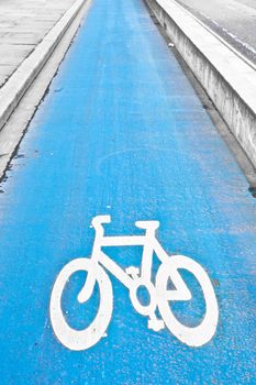 Blue designated cycle path in a city