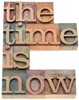 the time is now - motivational concept - isolated text in letterpress wood type