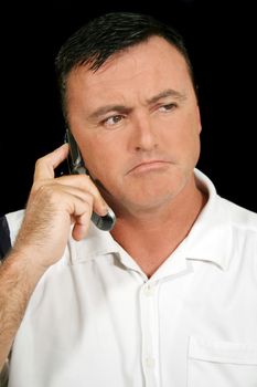 Unhappy man on a cell phone call.