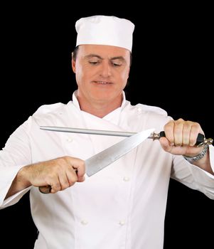 Chef busy sharpening his cooking knife with a steel.