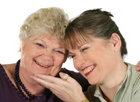 Mother and daughter laughing and enjoying quality time together.
