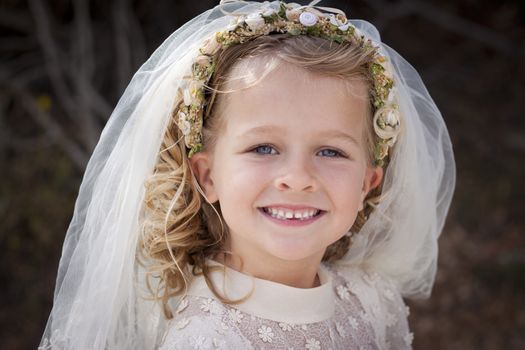 A young child doing her first communion