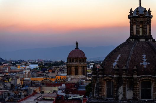 Church domes and cityscape in Mexico City