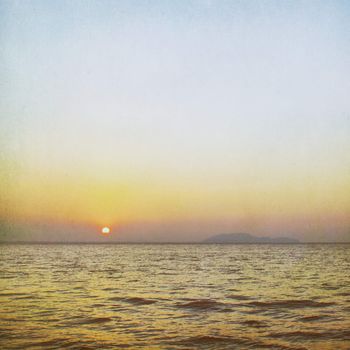 Vintage background of sunrise over the sea 