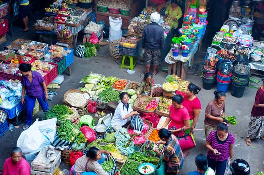 Ubud, Bali island, Indonesia - April 23, 2013: People buying a food at Ubud market in Bali, Indonesia. Ubud Market is very famous among Balinese, located in center of Ubud Village and in front of Ubud Palace.