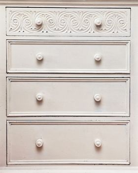 White vintage chest of drawers as a background image