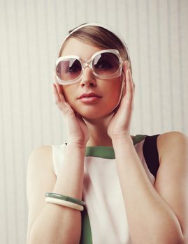 Portrait of fashion woman with retro sunglasses. 1960 style
