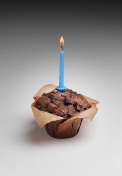 Happy birthday! Chocolate muffin with a candle