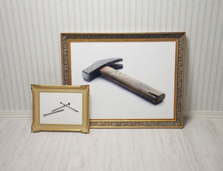 Hammer and nails on baroque frames, bricolage concept