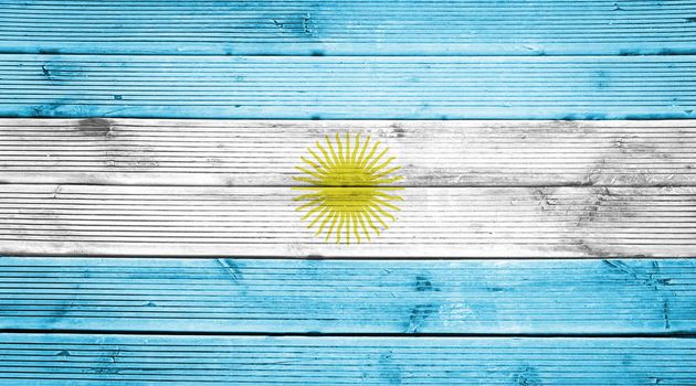 Natural wood planks texture background with the colors of the flag of Argentina
