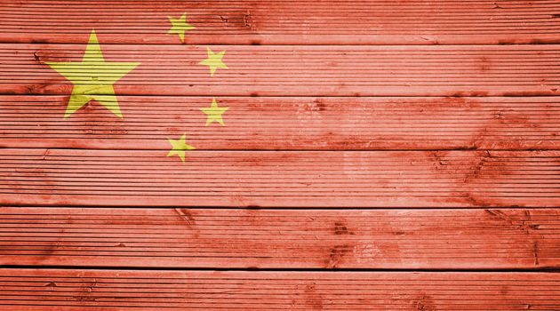 Natural wood planks texture background with the colors of the flag of China