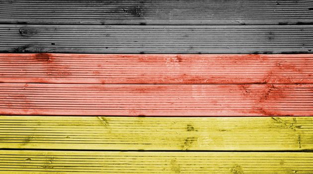 Natural wood planks texture background with the colors of the flag of Germany