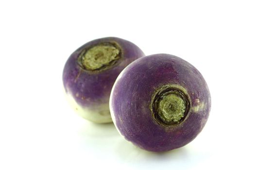 purple headed turnips with slices on white background