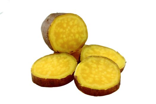 cutting sweet potatoes on white background