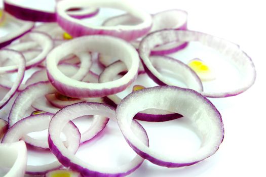 Red sliced onion on white background.
