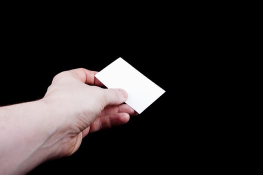 Man hand holding a blank business card.