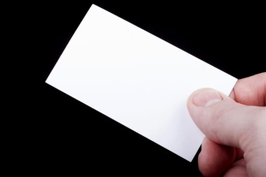 Man hand holding a blank business card.