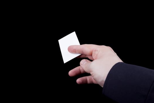 Man hand holding a blank business card.