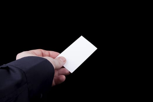 Man hand holding a blank business card.