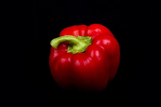 red pepper isolated on a black background