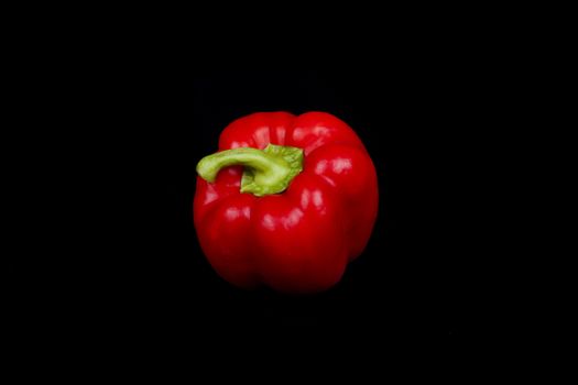 red pepper isolated on a black background