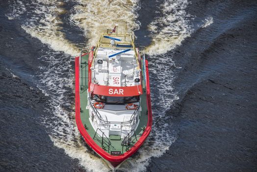 Rescue boat RS 142, Horn Flyer escorts MS Sj��kurs with NRK through Ringdalsfjord, heading for the port of Halden. Photo is shot from Svinesund bridge, Halden, Norway.