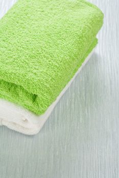 white and green towels