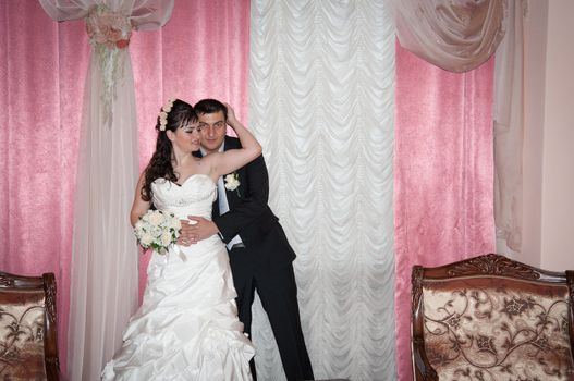 bride and groom in the living room