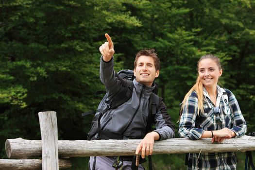 Portrait of young couple hikers enjoying nature