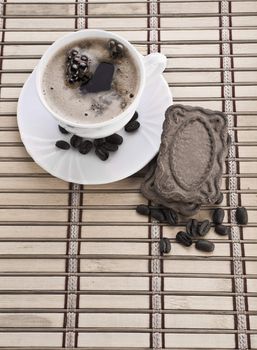 composition of coffee mug with beans and cookie