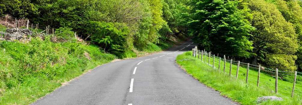 A winding rural road in Northumberland, England