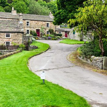 Hillside stone cottages in Blanchland village, Northumberland