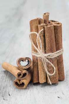 Cinnamon sticks on an old wooden table background