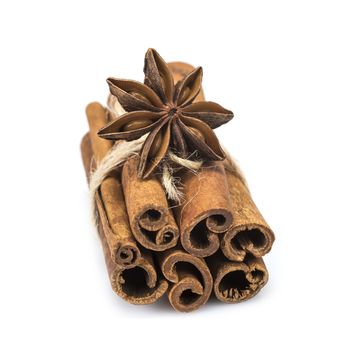 Cinnamon sticks and star anise isolated over a white background