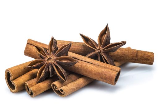 Cinnamon sticks and star anise isolated over a white background