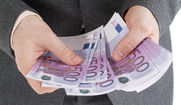 stack banknotes of 500 euro in male hands on a white background