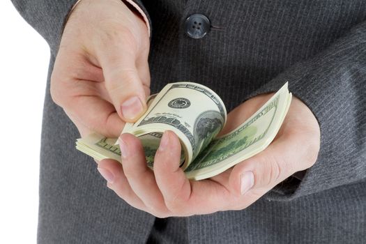 stack banknotes of 100 dollars in male hands on a white background